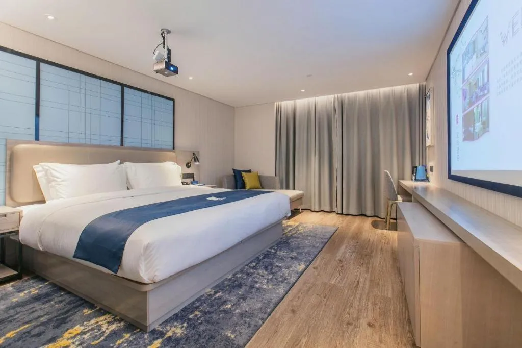 Bed in Echarm Hotel Wuhan Huangpi Xiangyang Avenue