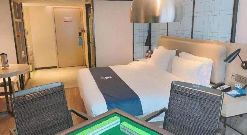 Bed in Echarm Hotel Wuhan Huangpi Xiangyang Avenue