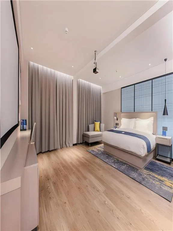Bed in Echarm Hotel Wuhan Huangpi Xiangyang Avenue