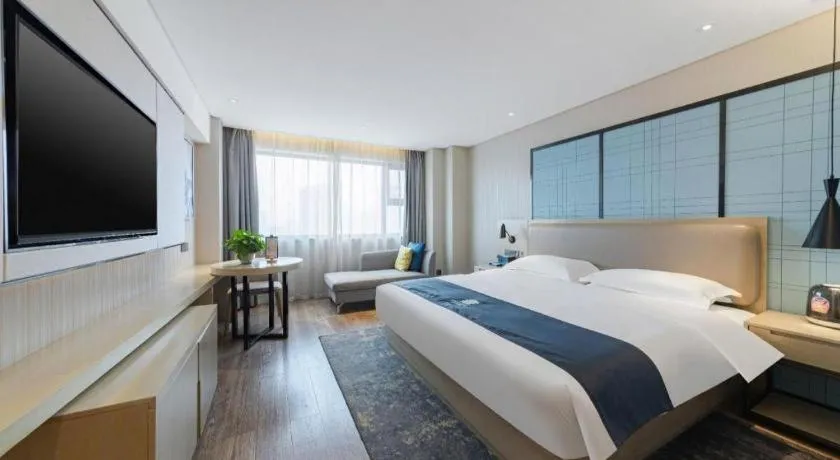Bed in Echarm Hotel Wuhan Huangpi Xiangyang Avenue