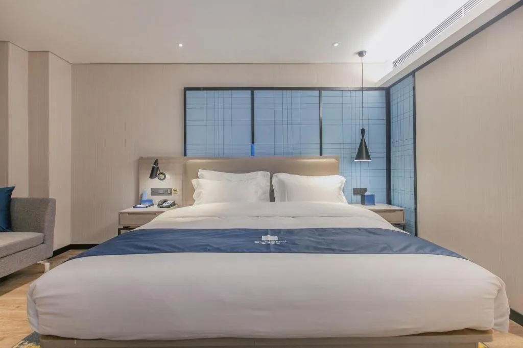 Bed in Echarm Hotel Wuhan Huangpi Xiangyang Avenue
