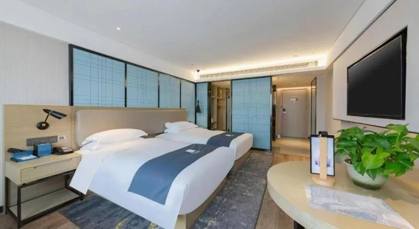 Bed in Echarm Hotel Wuhan Huangpi Xiangyang Avenue