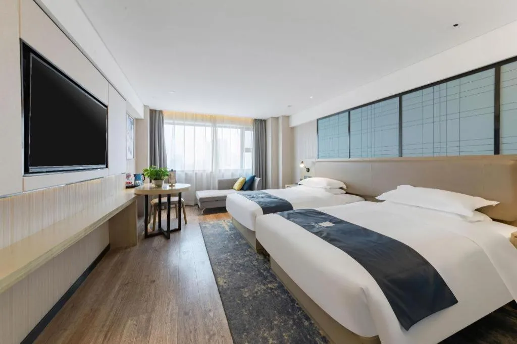 Bed in Echarm Hotel Wuhan Huangpi Xiangyang Avenue