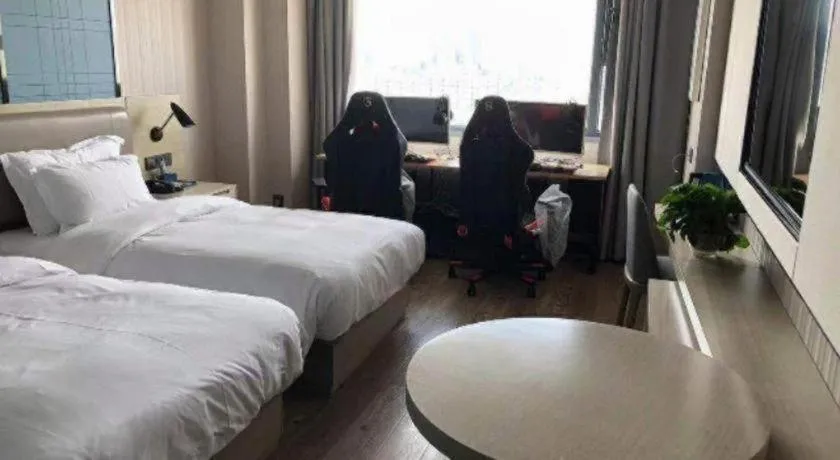 Bed in Echarm Hotel Wuhan Huangpi Xiangyang Avenue