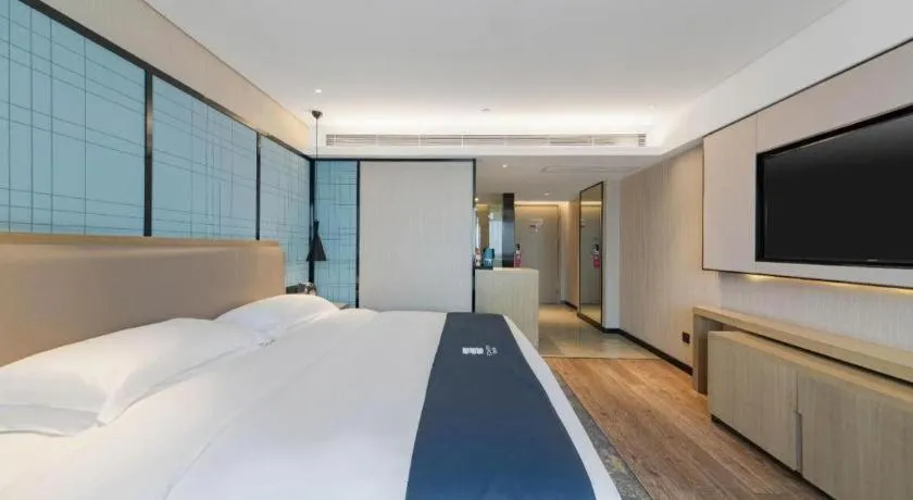 Bed in Echarm Hotel Wuhan Huangpi Xiangyang Avenue