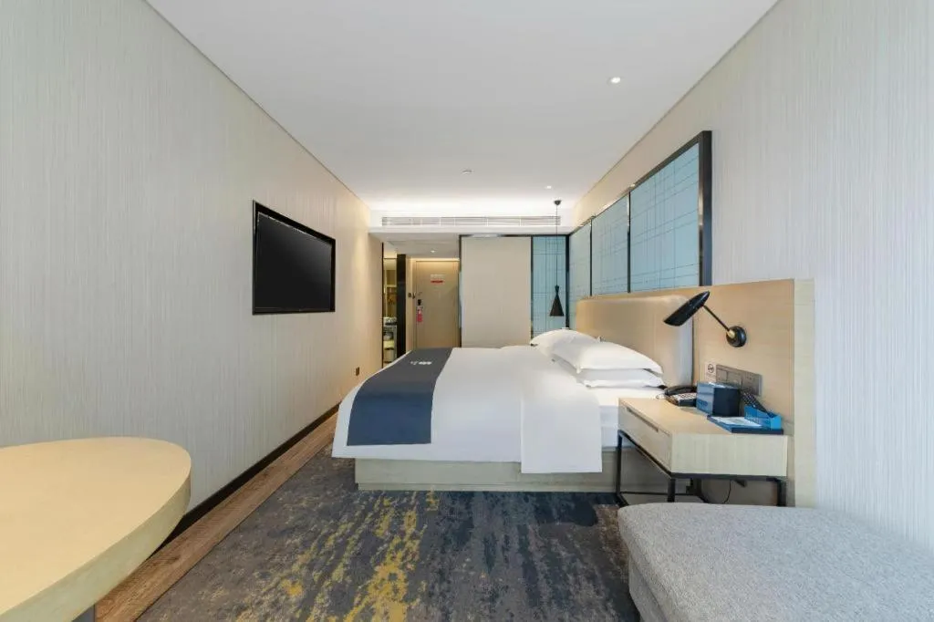 Bed in Echarm Hotel Wuhan Huangpi Xiangyang Avenue