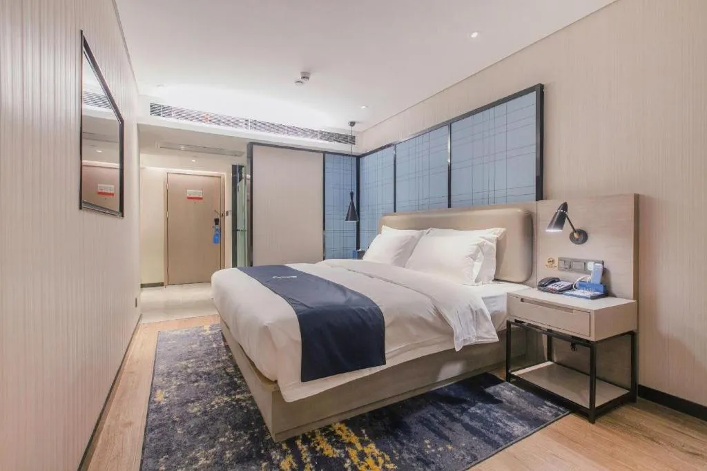 Bed in Echarm Hotel Wuhan Huangpi Xiangyang Avenue