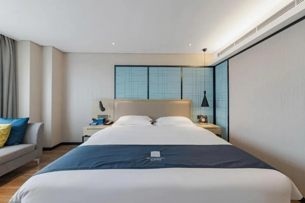 Bed in Echarm Hotel Wuhan Huangpi Xiangyang Avenue