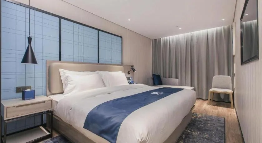 Bed in Echarm Hotel Wuhan Huangpi Xiangyang Avenue