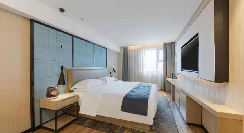 Bed in Echarm Hotel Wuhan Huangpi Xiangyang Avenue