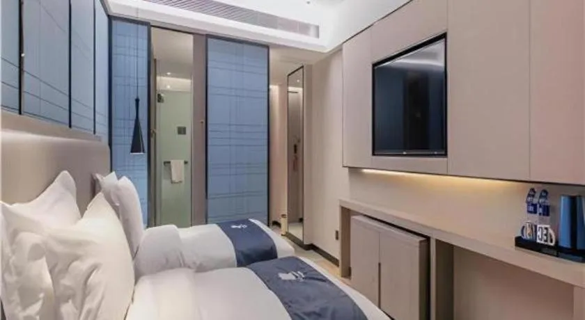 Bed in Echarm Hotel Wuhan Huangpi Xiangyang Avenue