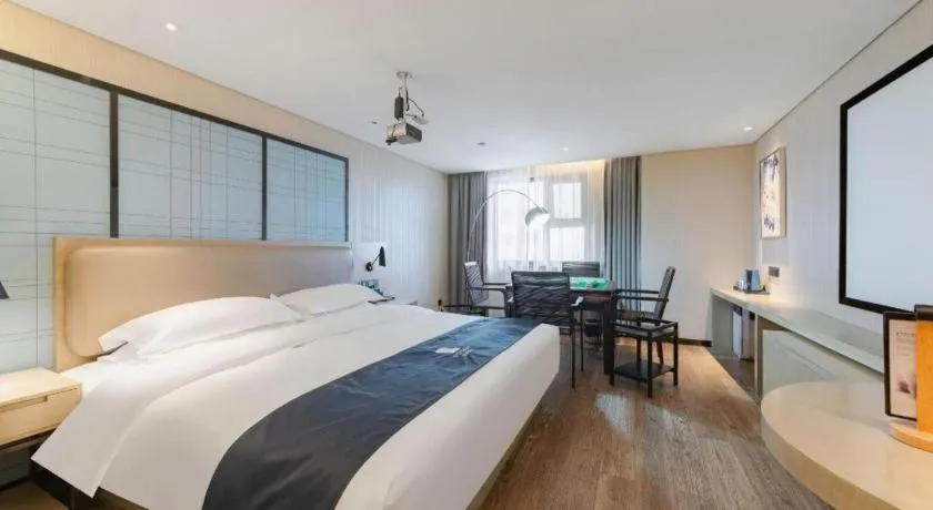 Bed in Echarm Hotel Wuhan Huangpi Xiangyang Avenue