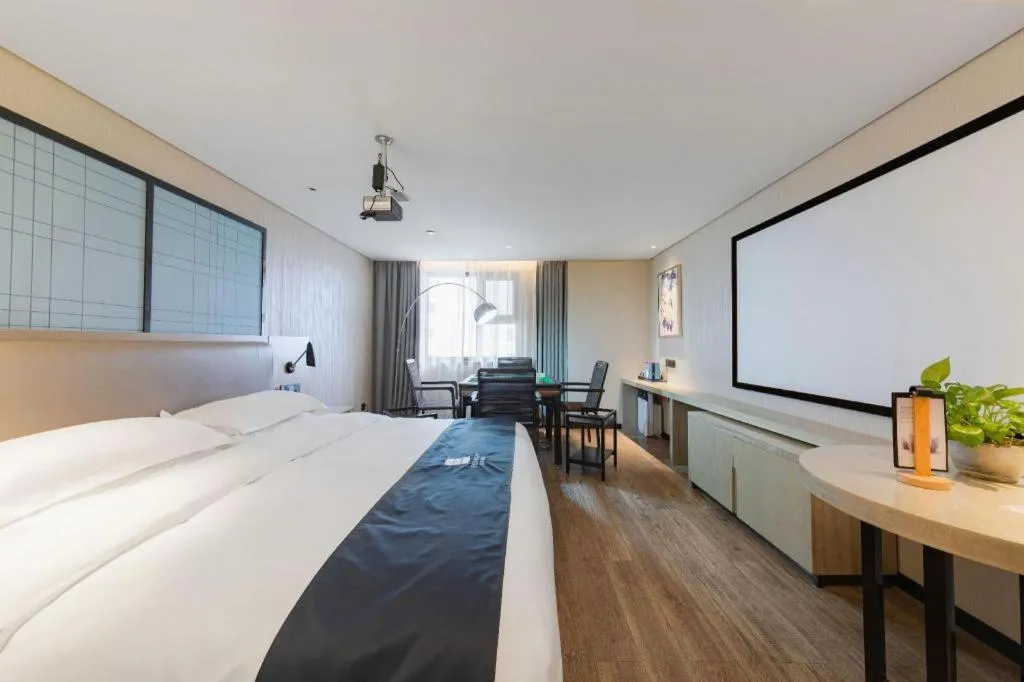 Bed in Echarm Hotel Wuhan Huangpi Xiangyang Avenue