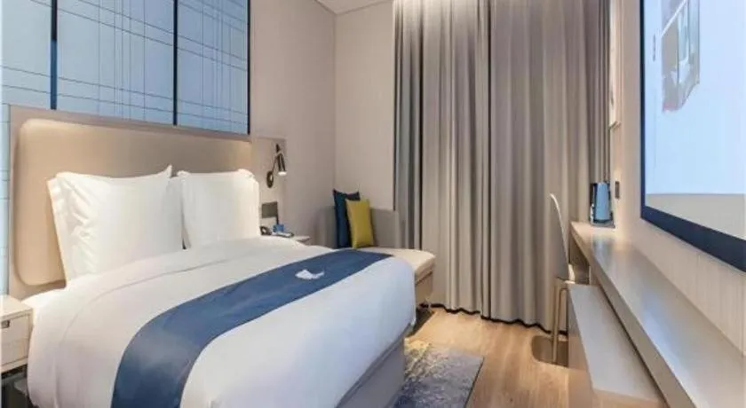 Bed in Echarm Hotel Wuhan Huangpi Xiangyang Avenue