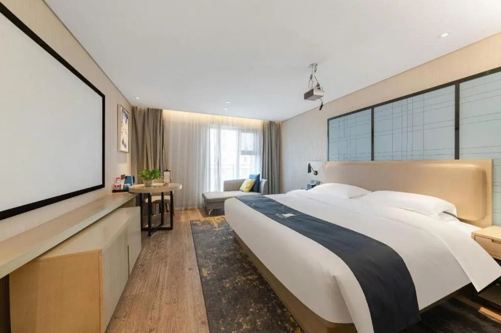Bed in Echarm Hotel Wuhan Huangpi Xiangyang Avenue