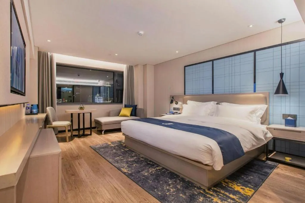 Bed in Echarm Hotel Wuhan Huangpi Xiangyang Avenue