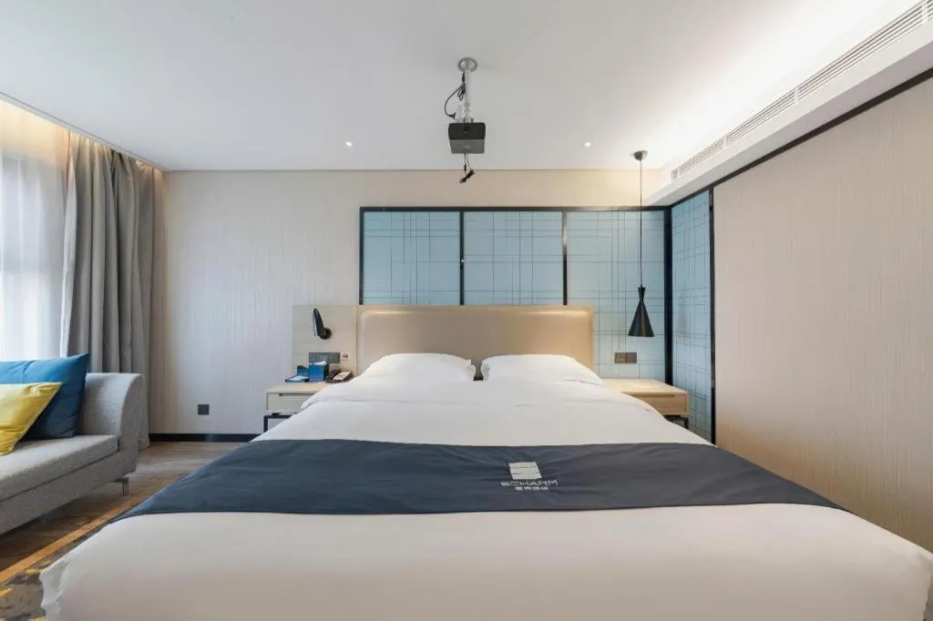 Bed in Echarm Hotel Wuhan Huangpi Xiangyang Avenue