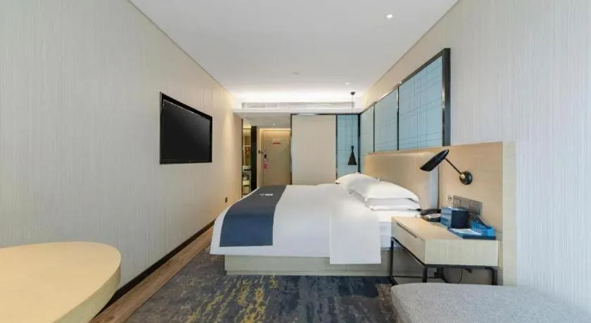 Bed in Echarm Hotel Wuhan Huangpi Xiangyang Avenue