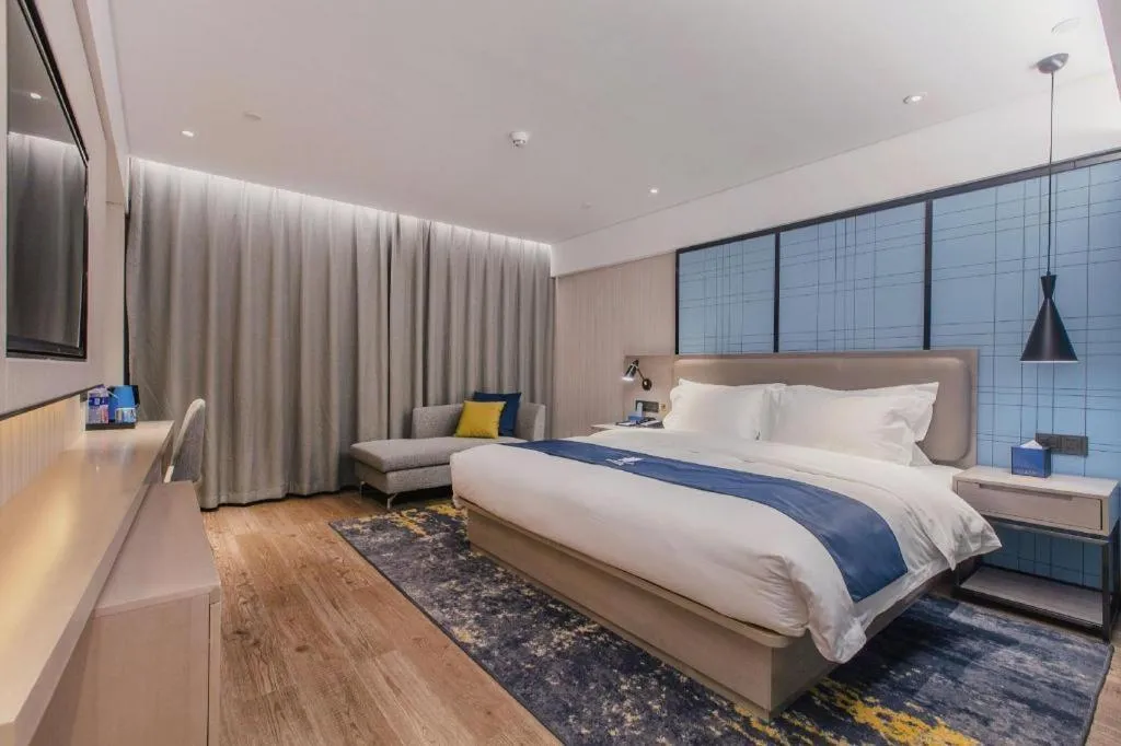 Bed in Echarm Hotel Wuhan Huangpi Xiangyang Avenue