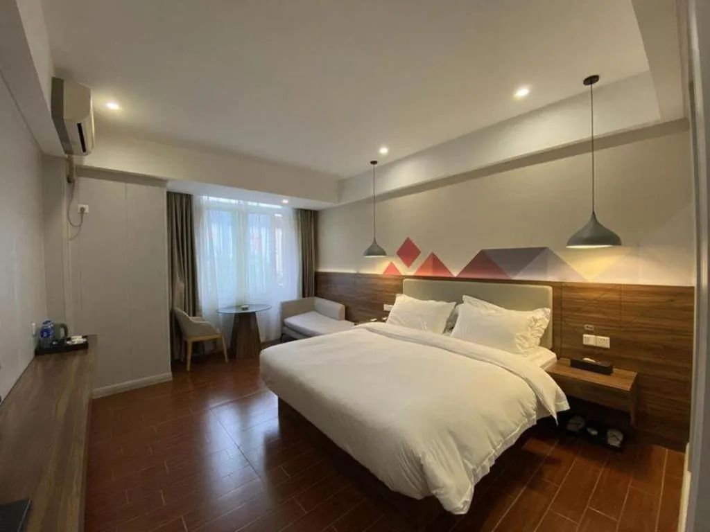 Bed in Borrman Hotel Shaoguan Century East Street Fengcai Building