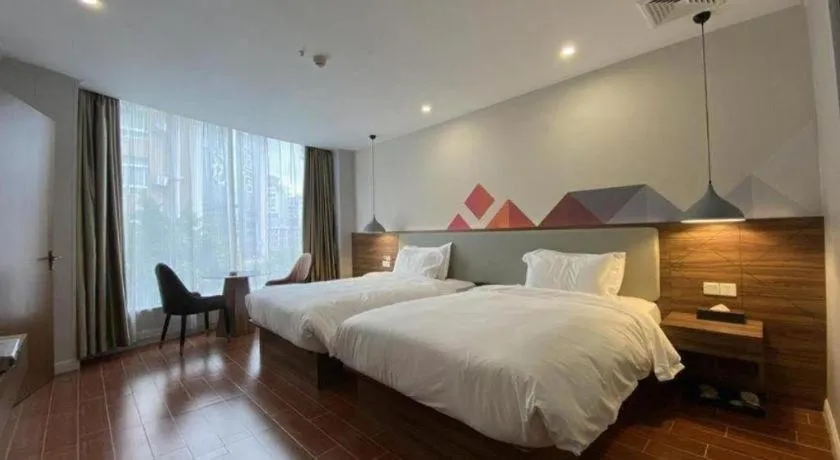 Bed in Borrman Hotel Shaoguan Century East Street Fengcai Building
