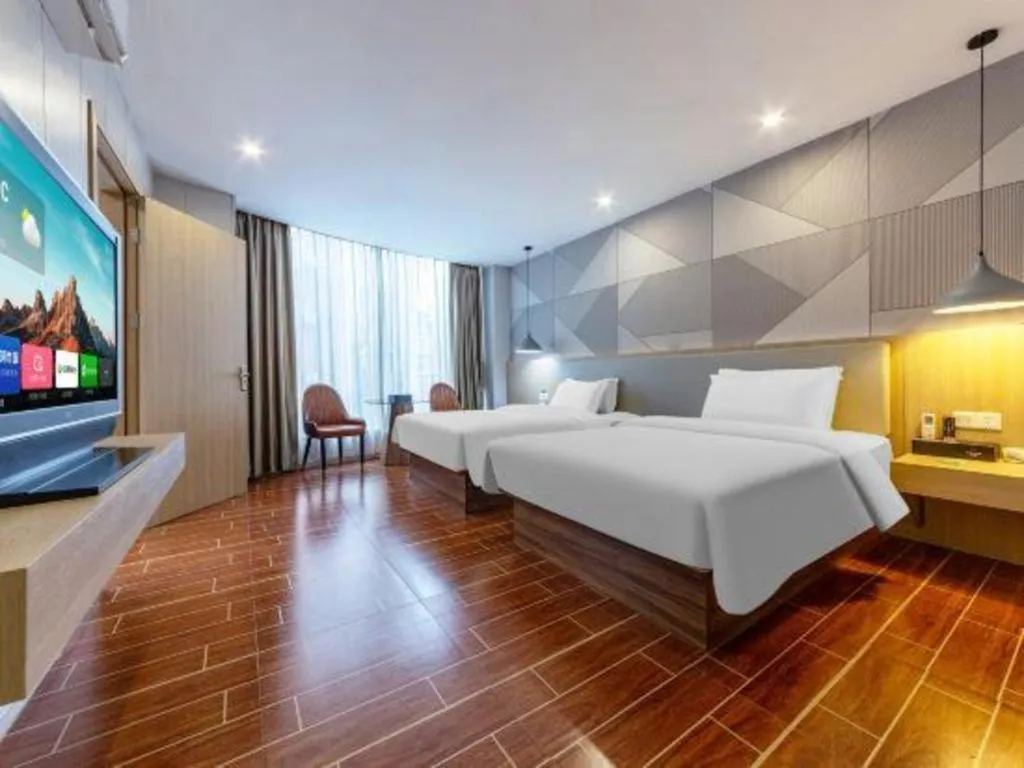 Bed in Borrman Hotel Shaoguan Century East Street Fengcai Building