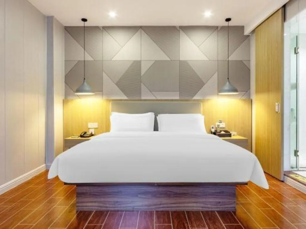 Bed in Borrman Hotel Shaoguan Century East Street Fengcai Building