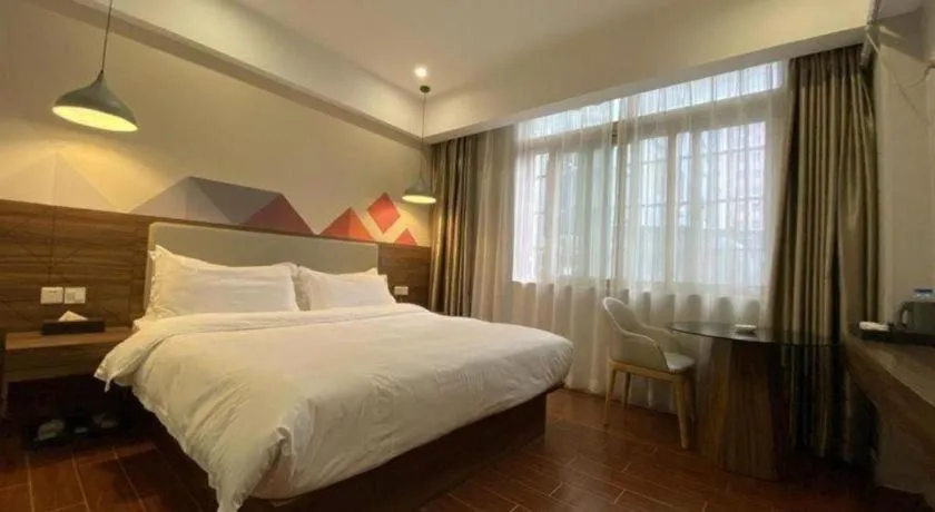 Bed in Borrman Hotel Shaoguan Century East Street Fengcai Building