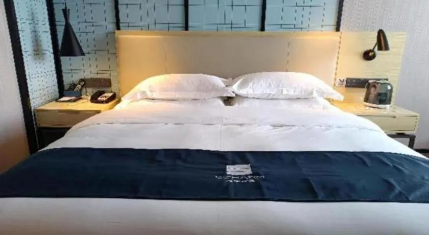 Bed in Echarm Hotel Foshan Jiaokou Metro Station Jiazhou Plaza