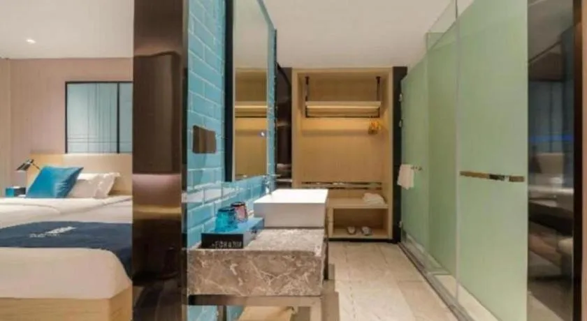 Bed in Echarm Hotel Foshan Jiaokou Metro Station Jiazhou Plaza