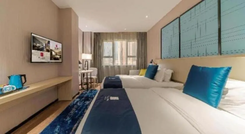 Bed in Echarm Hotel Foshan Jiaokou Metro Station Jiazhou Plaza