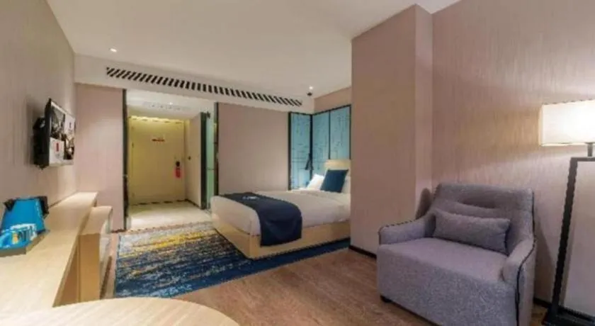 Bed in Echarm Hotel Foshan Jiaokou Metro Station Jiazhou Plaza