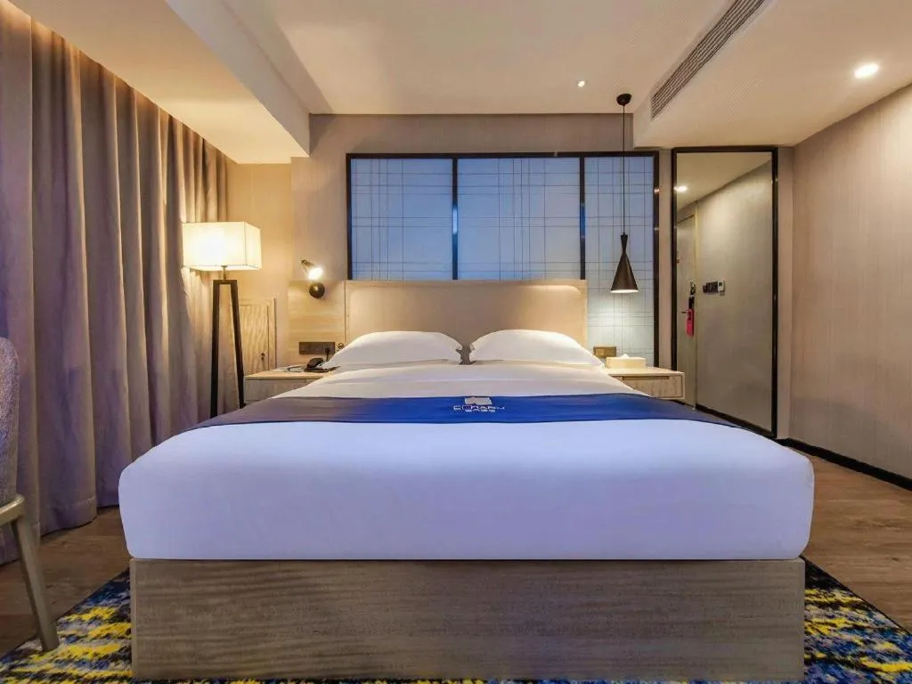 Bed in Echarm Hotel Guiyang North High-speed Railway Station
