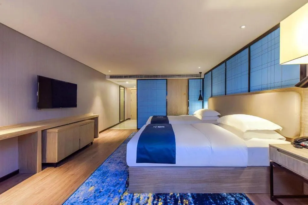 Bed in Echarm Hotel Guiyang North High-speed Railway Station
