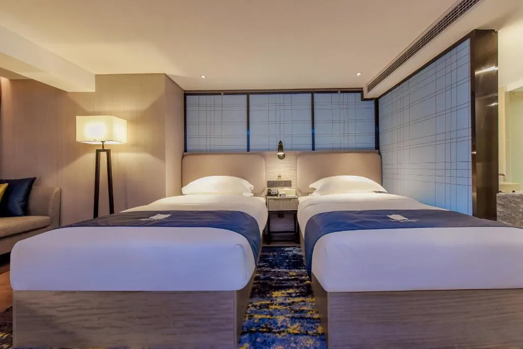 Bed in Echarm Hotel Guiyang North High-speed Railway Station