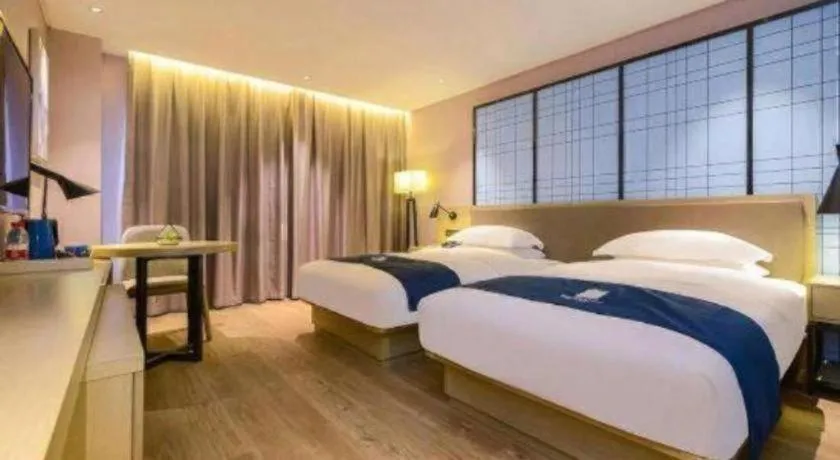Bed in Echarm Hotel Guiyang North High-speed Railway Station
