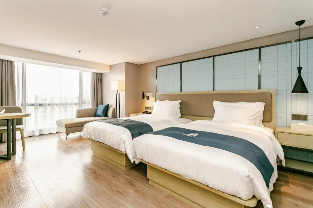 Bed in Echarm Hotel Guiyang North High-speed Railway Station