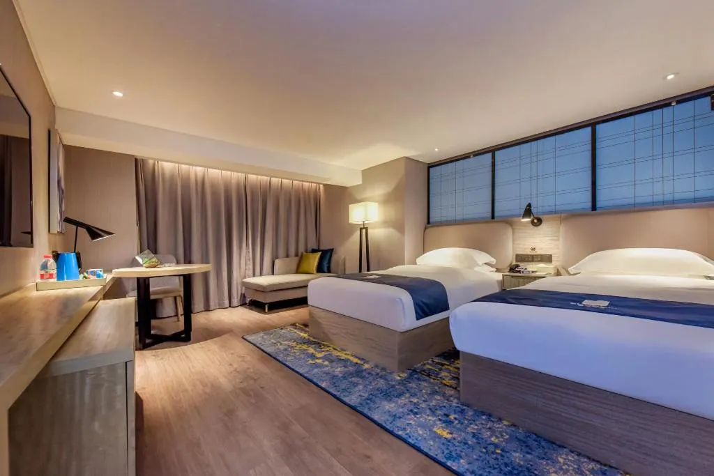 Bed in Echarm Hotel Guiyang North High-speed Railway Station