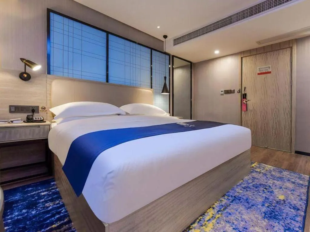 Bed in Echarm Hotel Guiyang North High-speed Railway Station