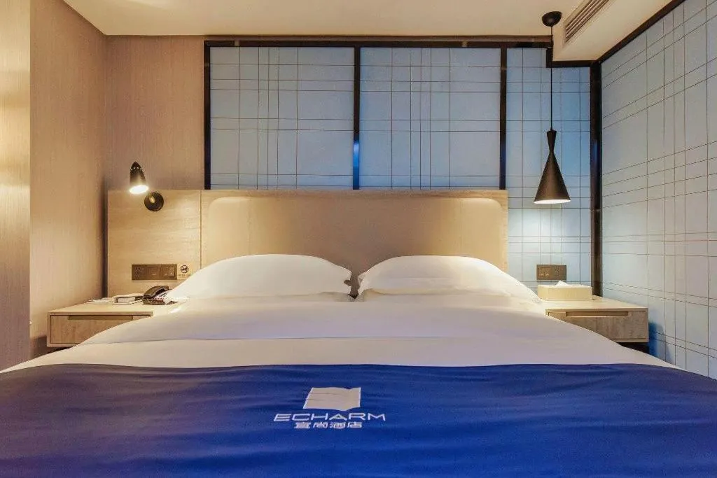 Bed in Echarm Hotel Guiyang North High-speed Railway Station