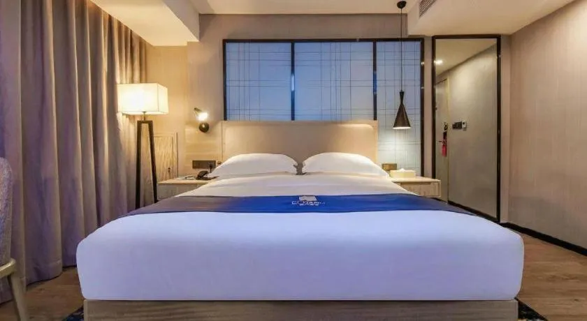 Bed in Echarm Hotel Guiyang North High-speed Railway Station