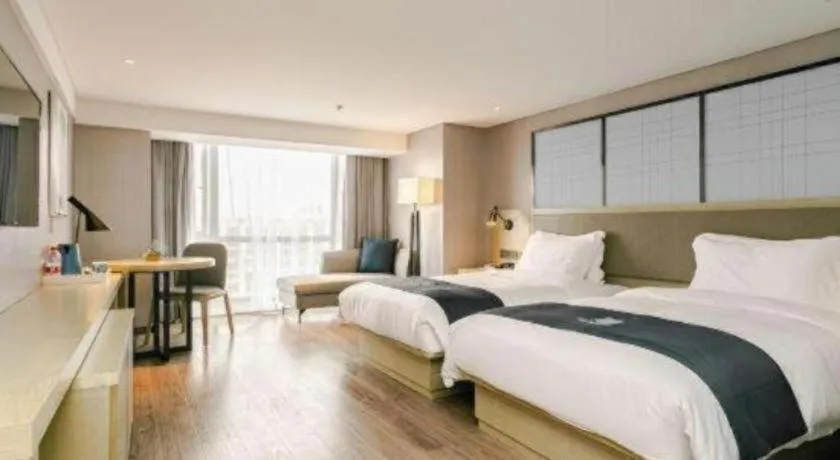 Bed in Echarm Hotel Guiyang North High-speed Railway Station