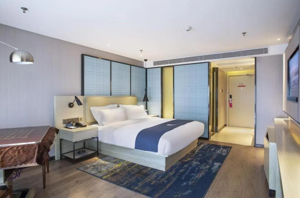 Bed in Echarm Hotel Guiyang North High-speed Railway Station