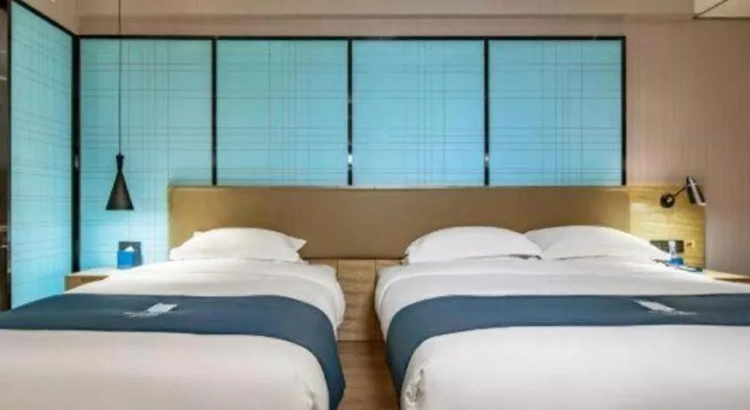 Bed in Echarm Hotel Guilin Railway Station the MixC