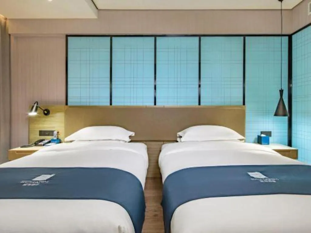 Bed in Echarm Hotel Guilin Railway Station the MixC