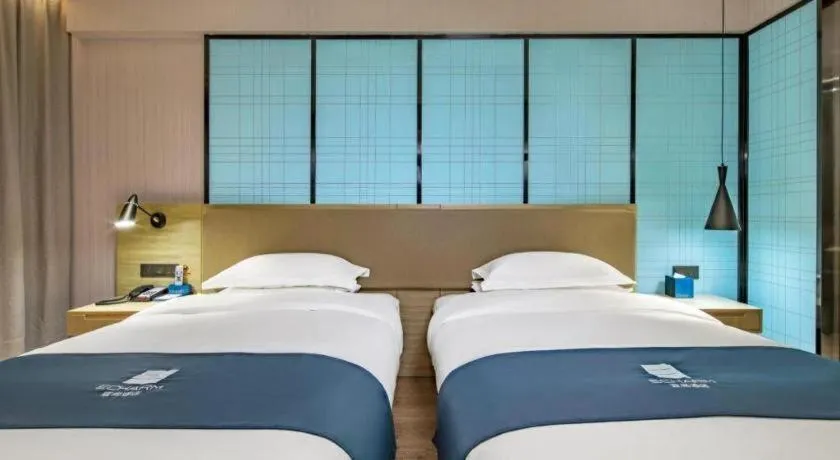 Bed in Echarm Hotel Guilin Railway Station the MixC