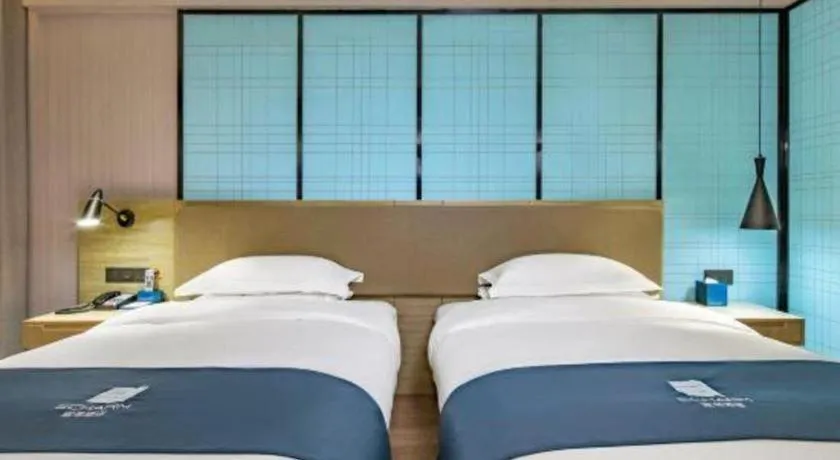 Bed in Echarm Hotel Guilin Railway Station the MixC