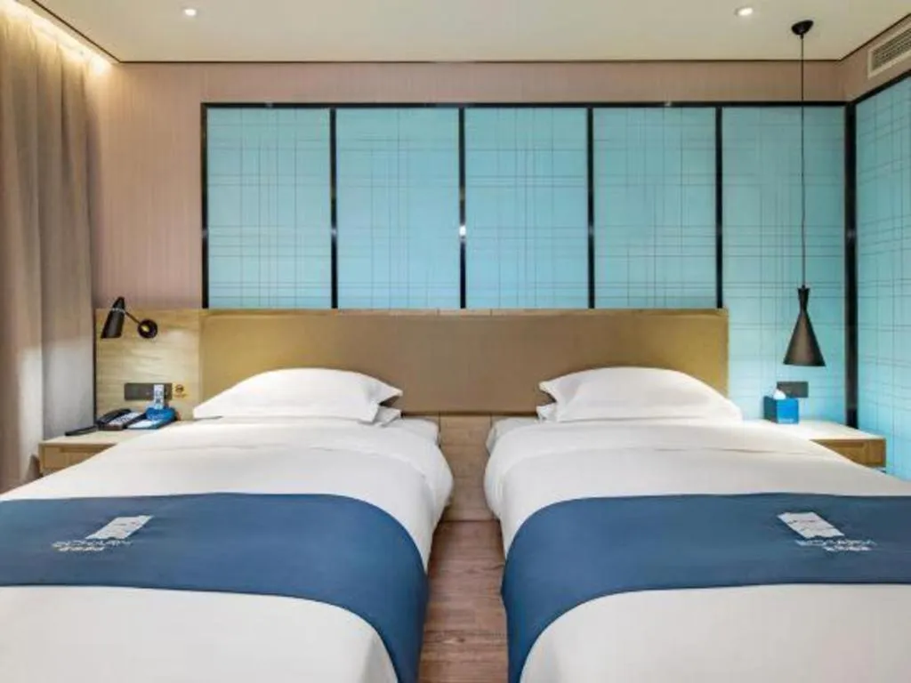 Bed in Echarm Hotel Guilin Railway Station the MixC