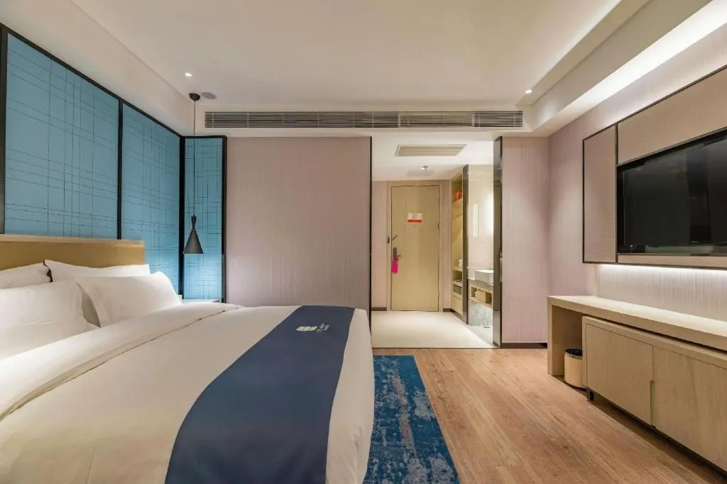 Bed in Echarm Hotel Tai'an Taishan Tianwai Village Hongmen