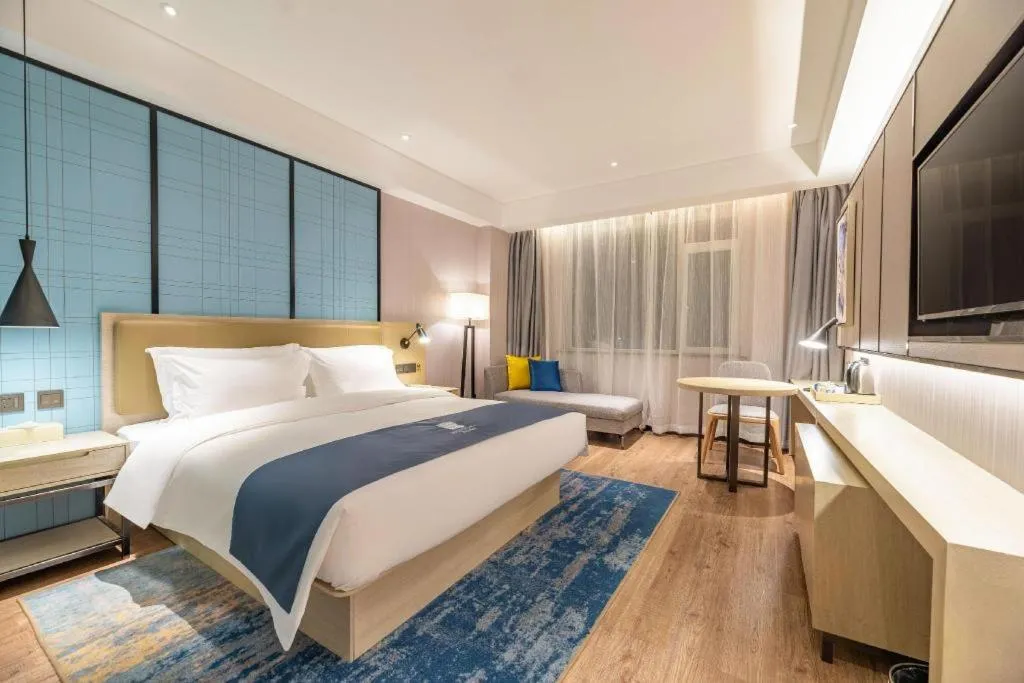 Bed in Echarm Hotel Tai'an Taishan Tianwai Village Hongmen